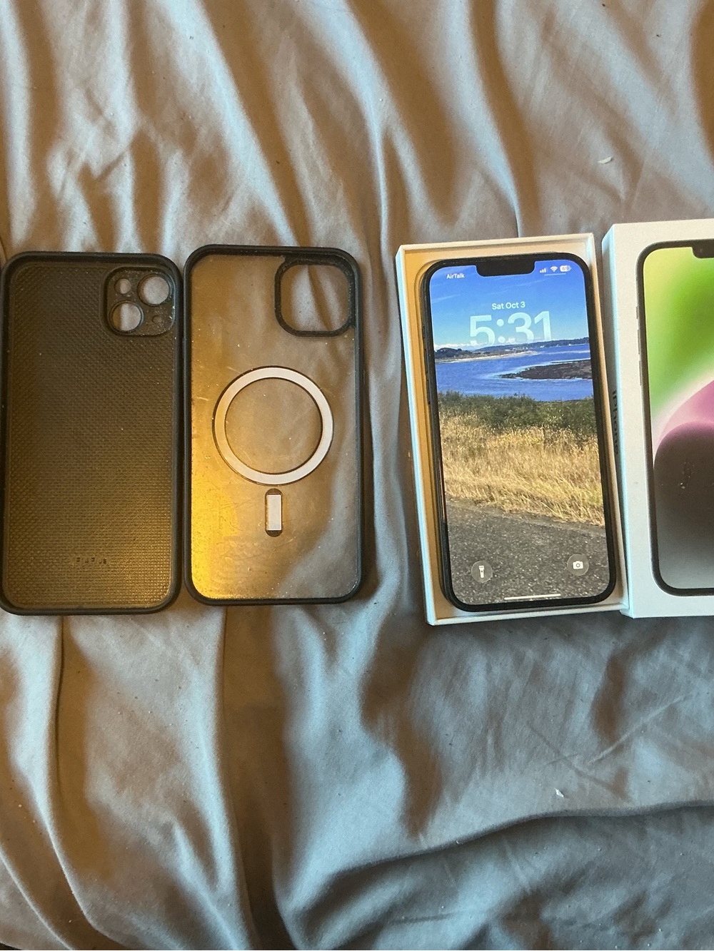 Apple iPhone 14 Plus with Two Black Protective Cases
